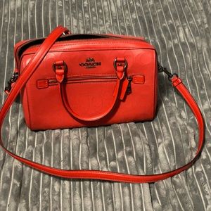 Coach Rowan leather satchel or crossbody in red.